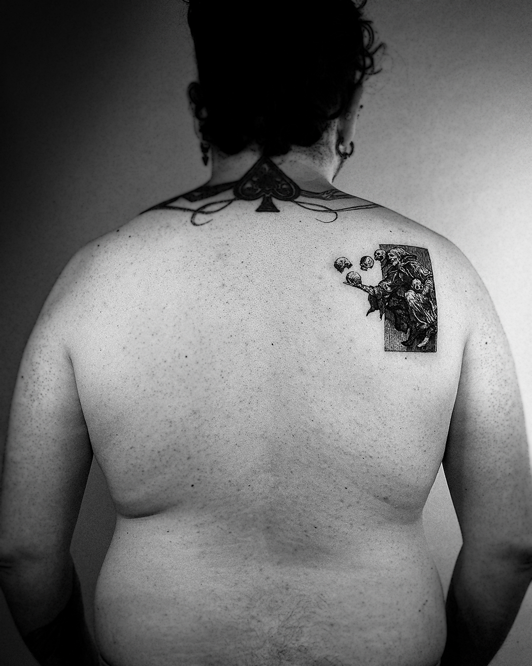 Wider full back view of the wearer showing the small jester woodcut piece on the right shoulder blade