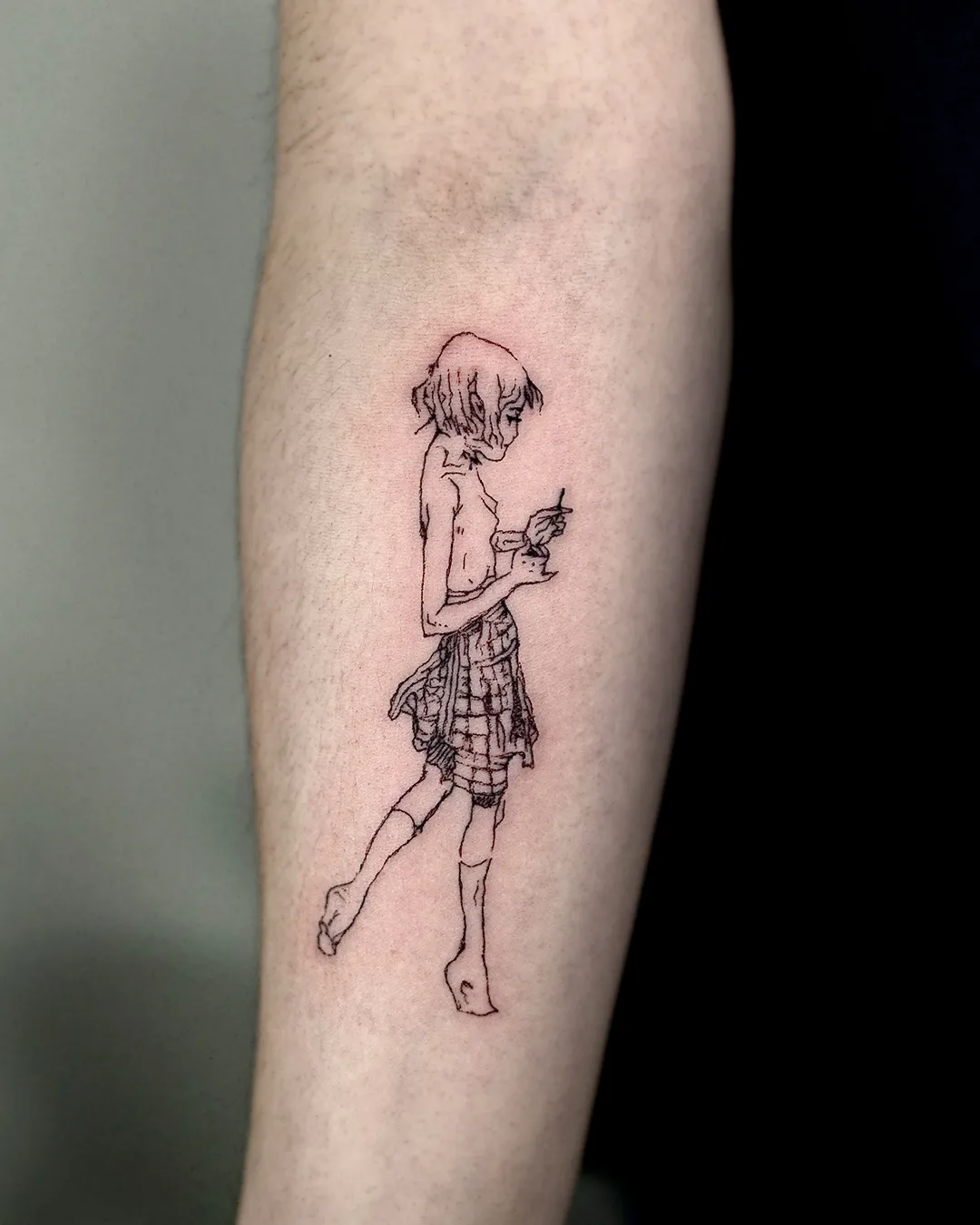 Manga-style figure with a motorbike, line tattoo on the forearm
